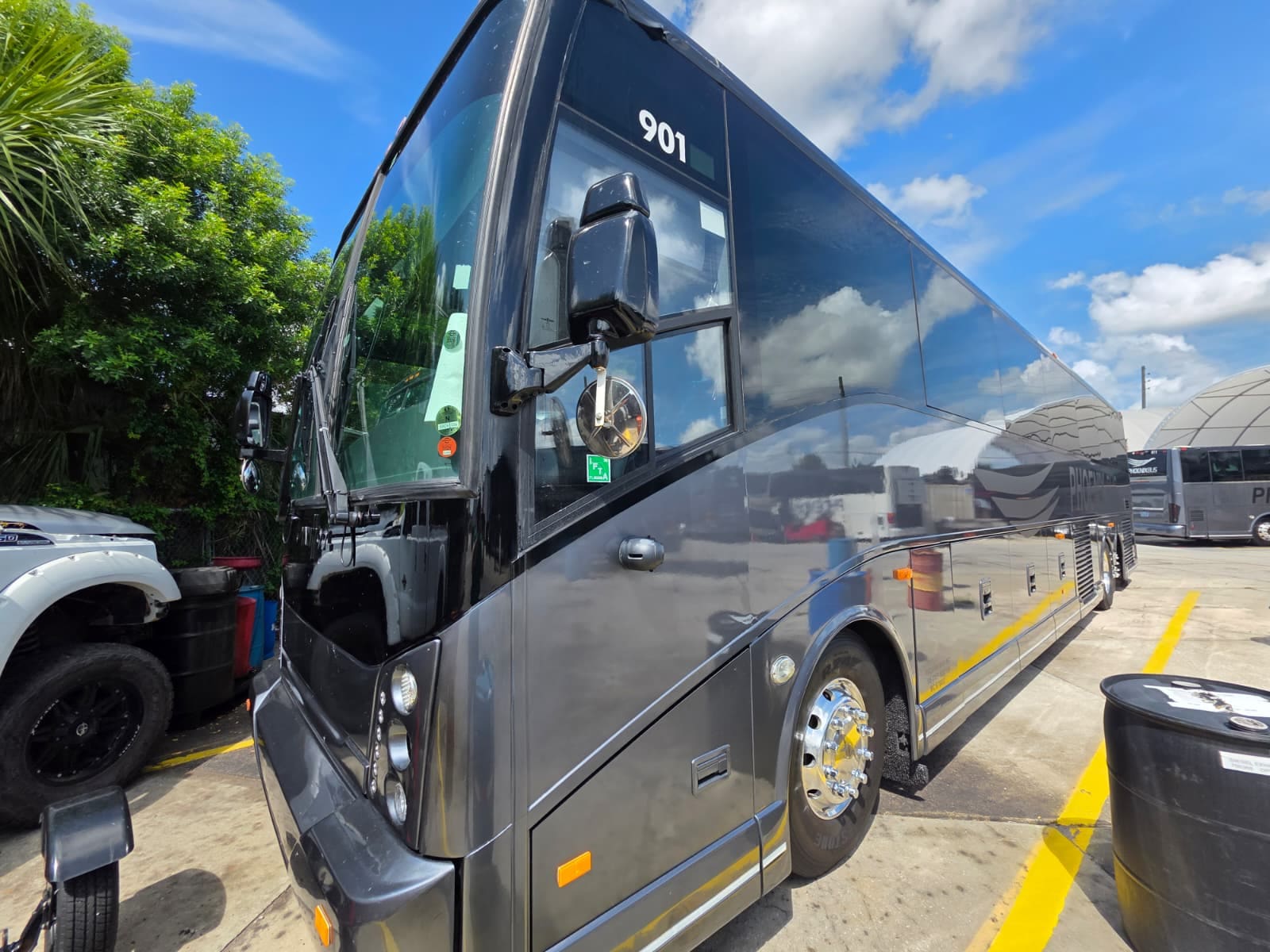 Front exterior of the Van Hool CX45 showing windshield and mirrors