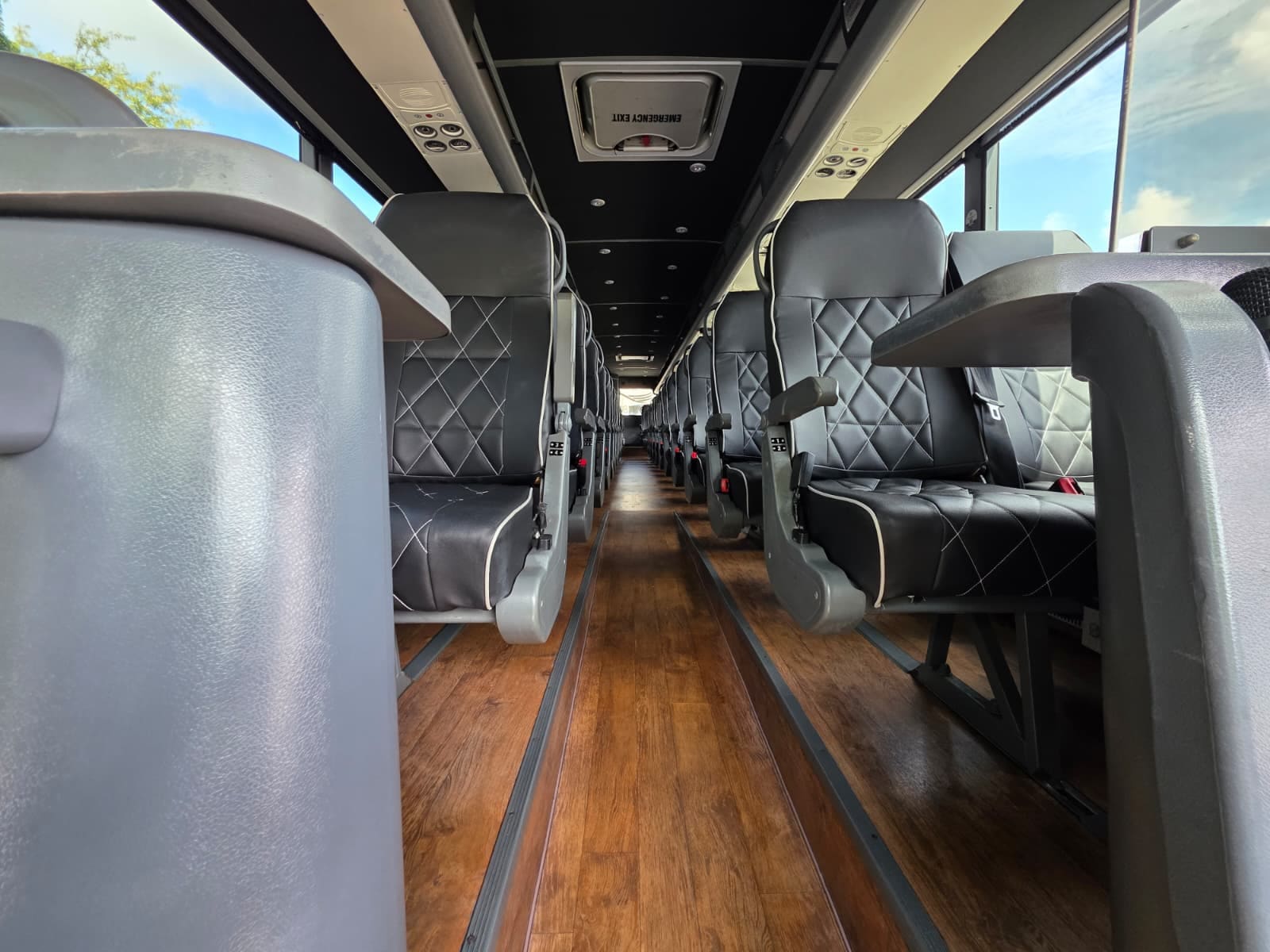 Center aisle with wood-look flooring, view to the rear