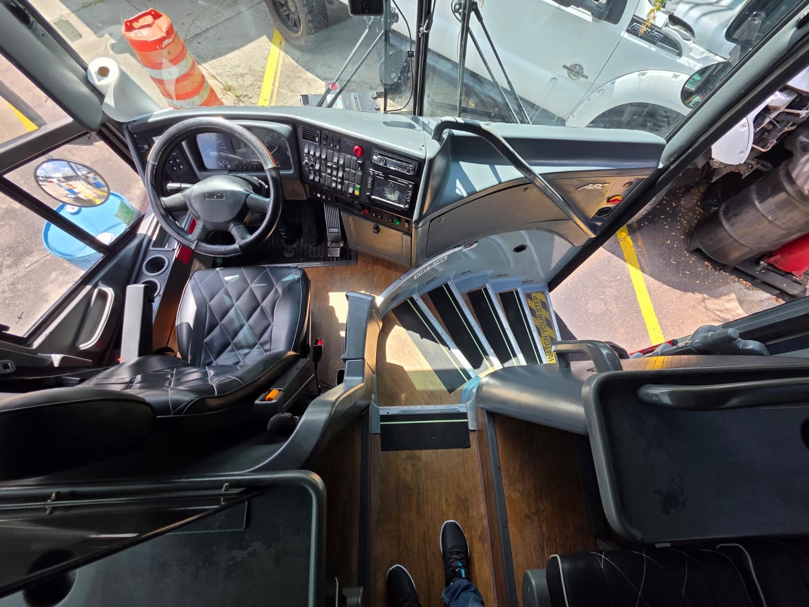 Driver cockpit with wraparound dash